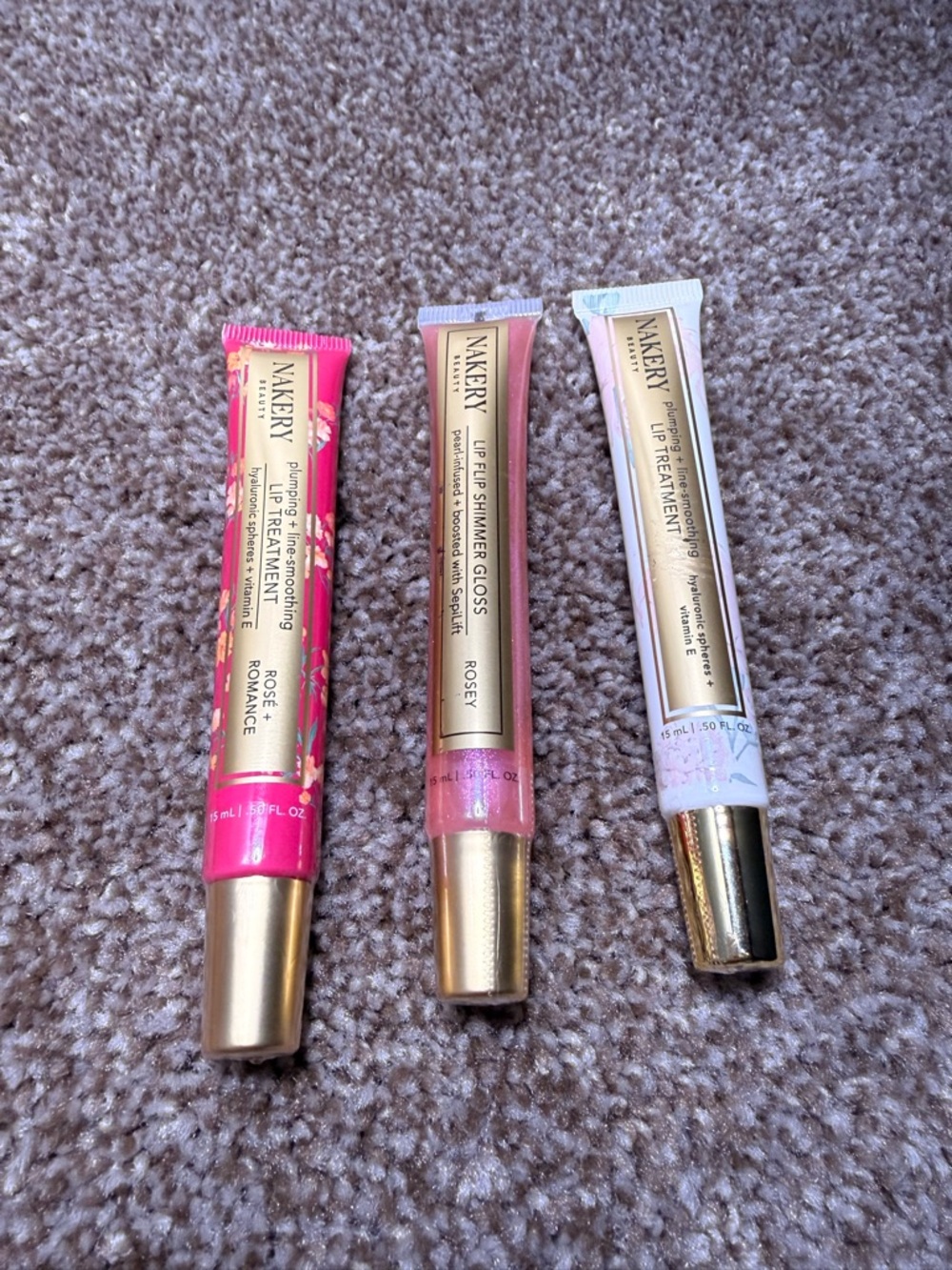 All three NAKERY Rosey Lip Gloss & Treatment Collection - Pink Shades